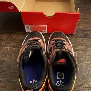 Nike Kids' Black and Brown Sneakers with Blue Accents
